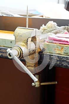 A vice on a metal workbench