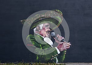 Mural by Ponchaveli featuring Vicente Fernandez, on the wall of Maxi Tax Services on Fort Worth Avenue in Oak Cliff