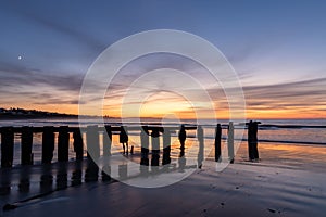 A Victor Harbor beach sunrise  over the erosion groynes  in South Australia on September 11th 2023