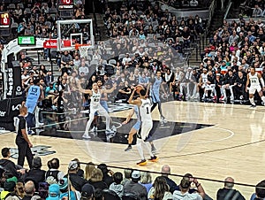 Victor Wembanyama shooting a three pointer at Spurs NBA game against Memphis Grizzlies