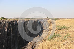 Victoria falls during dry season on holiday with sambesi river in zambia.
