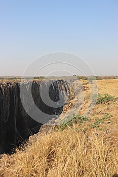 Victoria falls during dry season on holiday with sambesi river in zambia.