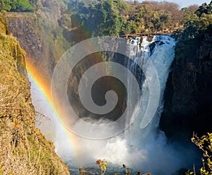 Victoria Falls. A general view with a rainbow. National park. Mosi-oa-Tunya National park. and World Heritage Site. Zambiya.