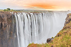 Victoria Falls, a waterfall in southern Africa at the Zambezi River at the border between Zambia and Zimbabwe. Milky water