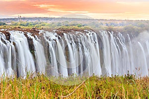 Victoria Falls, a waterfall in southern Africa at the Zambezi River at the border between Zambia and Zimbabwe. Milky water