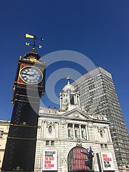 Victoria Palace Theatre London with the restored London Victoria Clock.