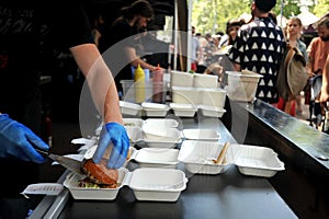 Fast food preparation of hamburger in an outdoor market in London England