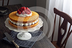Victoria Sponge Cake Layered with Whipped Cream and Berries