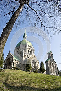 Victorian brick church on a green hill