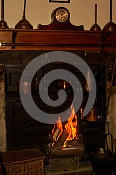 Victorian cast-iron range fireplace in cosy home