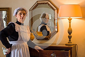 Victorian chambermaid posing