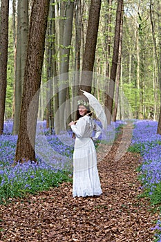 Victorian dress in bluebells forest