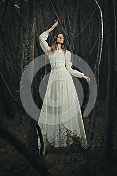 Victorian dressed woman levitation photo