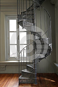 A Victorian era wrought cast iron spiral staircase in a restored building, Singapore