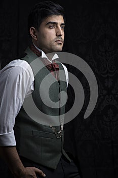 Victorian gentleman posing in a room resembling a study photo