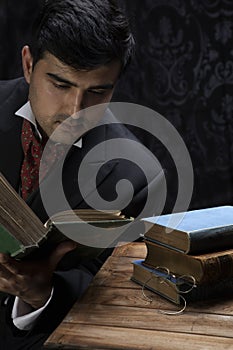 Victorian gentleman posing in a room resembling a study photo