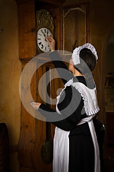 Victorian maid with antique clock