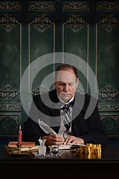 Victorian miser recording his money in ledger