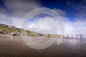 The Victorian pier at Saltburn which stretches out over the beach at low tide