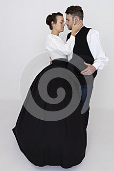 A Victorian pioneering couple posing against a white backdrop