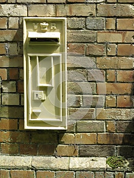 Victorian postbox in a brick wall