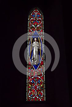 A Victorian Stained Glass Window depicting an Angel, within the Church of St Michael and All Angels