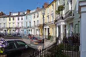 Victorian terraced houses neatly painted in pastel colours