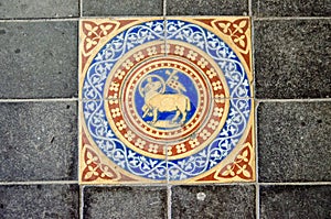 Victorian tile showing lamb and flag