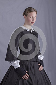 Victorian woman in a black bodice and skirt