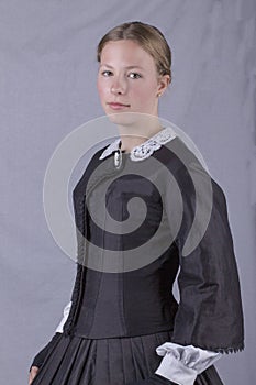 Victorian woman in a black bodice and skirt