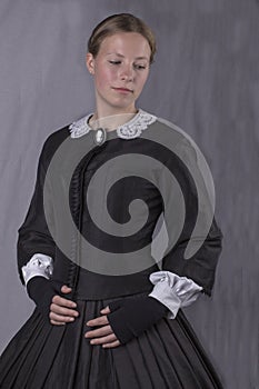 Victorian woman in black bodice and skirt photo