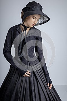 Victorian woman in black ensemble photo