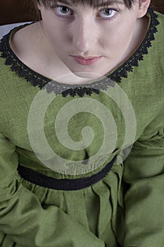 Victorian woman in a green bodice and skirt photo