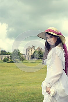 Victorian woman with manor house photo