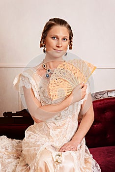 Victorian woman using lace fan