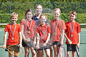 Victorious School Tennis Team With Medals photo