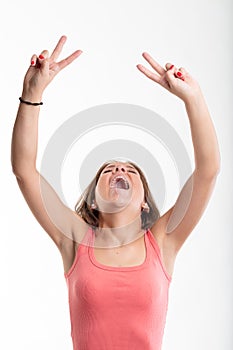 Victorious young woman cheering and laughing