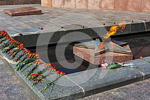 Victory day on 9 may, carnations flowers at eternal fire monument in honor or memory of the fallen soldiers in the great