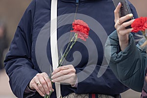 victory day, celebration of the end of the second world war, flowers in the hands of a symbol of victory over fascism