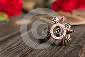 Victory Day.The may 9 celebrations.The girl holds her grandfather's Order of the red Star.Red carnations, St. George ribbon,