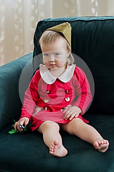 Victory Day Russia Baby girl in a military cap at home