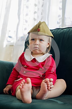 Victory Day Russia Baby girl in a military cap at home