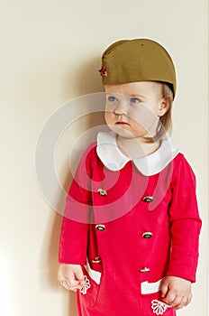 Victory Day Russia Baby girl in a military cap at home