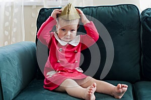 Victory Day Russia Baby girl in a military cap at home