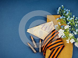 Victory Day Still Life, background for postcards by may 9, victory day: cap, letters, and St. George ribbon