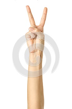 Victory sign. Woman hand gesturing isolated on white