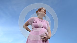 Video 360 degrees. Caucasian pregnant woman suffering from pain while experiencing prenatal contractions.