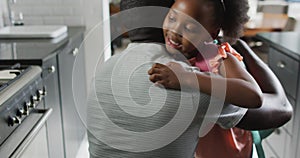 Video of african american father and daughter preparing breakfast