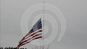 Video of American flag waving in wind at half mast