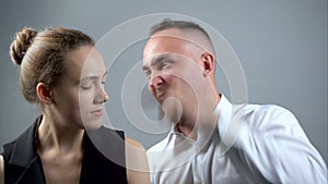 Video of angry man and girlfriend on grey background